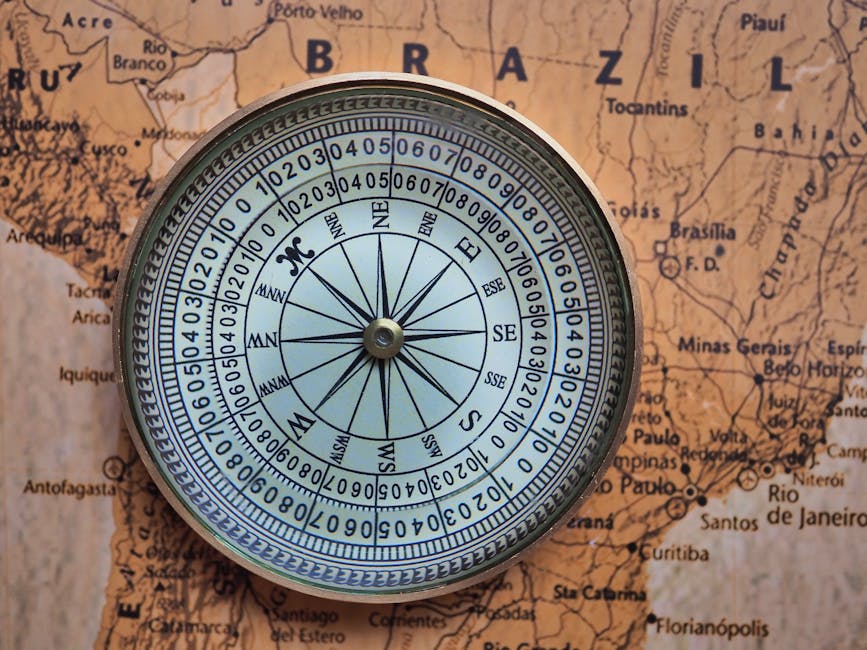 A vintage compass placed on a detailed map of Brazil, highlighting geographic exploration.